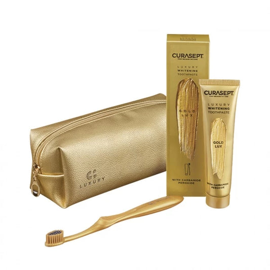 Curasept Luxury Whitening „Gold Lux“ dantų pastos, dantų 
šepetėlio ir kosmetinės rinkinys